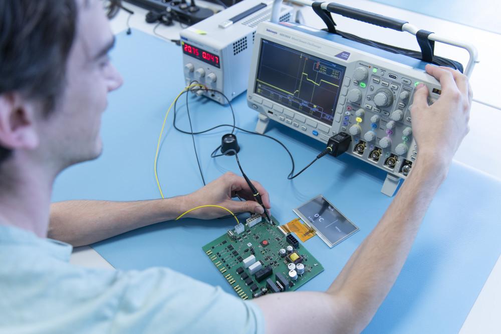 Engineer reviewing data on screens